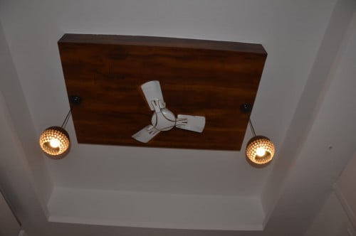wooden false ceiling with hanging light