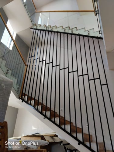 wooden stairs with steel railing 